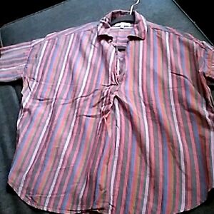 Multi colored top pull over buttons in the back of the shirt